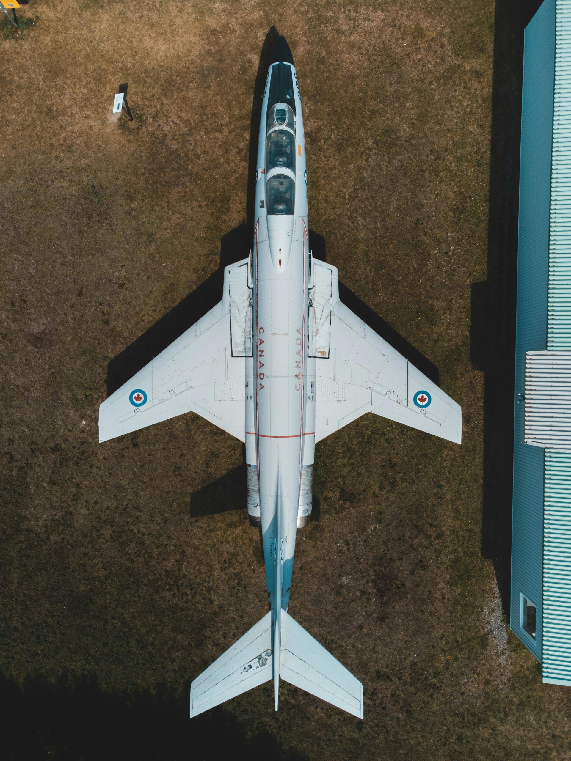 Top view of a fighter jet on an airfield in Canada showcasing aviation technology and aerospace design.